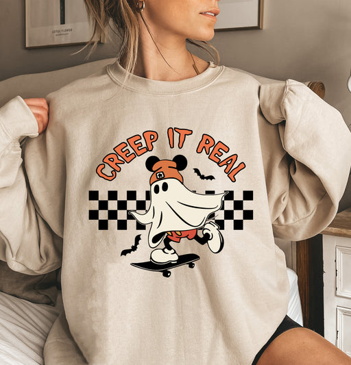 Fun sweatshirt featuring Mickey as a ghost with 'Creep It Real' text, perfect for Halloween fun.