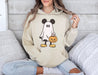 Get into the Halloween spirit with our Disney hoodie featuring a Mickey ghost design.