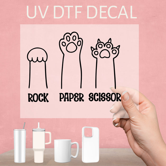 Funny Cat Rock Paper Scissors UV DTF decal, a playful design that adds humor to collection.