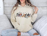 Cozy hoodie featuring Mickey and friends in Halloween costumes, perfect for festive warmth.