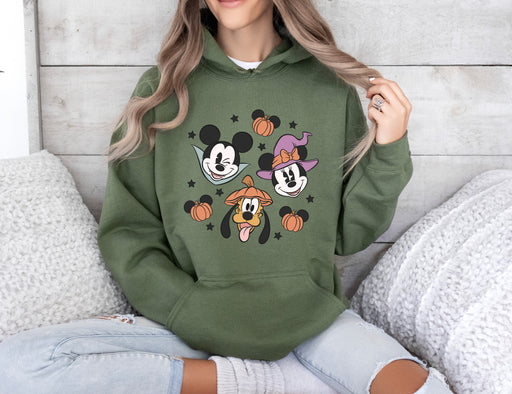 Get into the Halloween spirit with our hoodie featuring Mickey, Minnie, and Goofy.