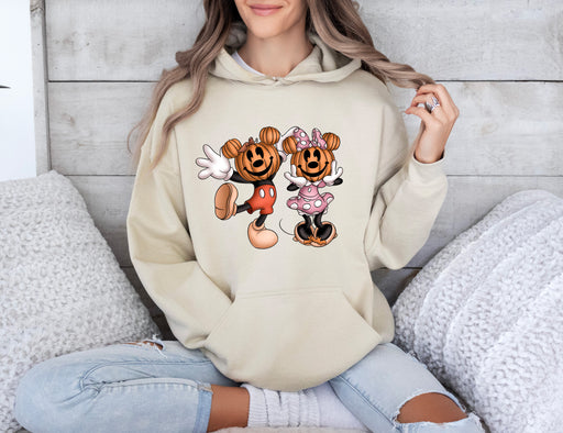 Get into the Halloween spirit with our hoodie featuring Mickey and Minnie with pumpkins.