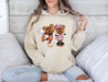 Get into the Halloween spirit with our hoodie featuring Mickey and Minnie with pumpkins.