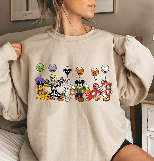 Festive sweatshirt featuring Mickey Mouse with Halloween themed balloons, ideal for spooky season.