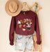 Cozy sweatshirt featuring Mickey with a pumpkin design, perfect for celebrating Halloween.