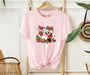 Celebrate the holidays with our Minnie, Daisy, and Mrs. Claus Disney Christmas shirt.