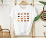 Embrace autumn vibes with our natural colors fall shirt featuring small hearts