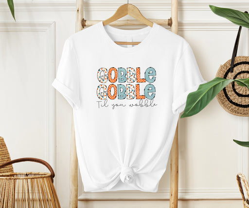 Join the fun this Thanksgiving with our 'Til You Wobble Gobble Gobble shirt, a playful choice.